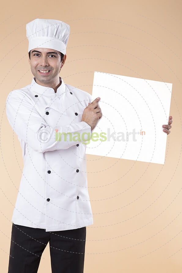 chef pointing at placard