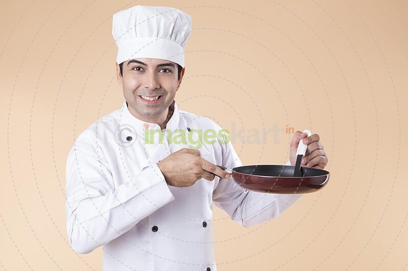 chef with frying pan