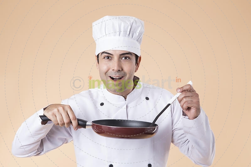 chef with frying pan