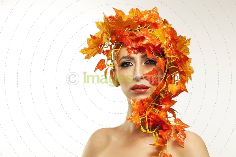 beautiful young woman portraying autumn