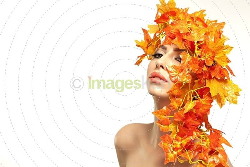 beautiful young woman portraying autumn
