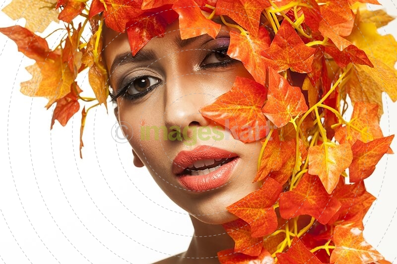 beautiful young woman portraying autumn