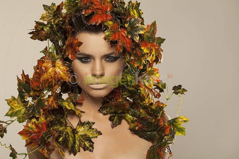 woman covered in leaves 