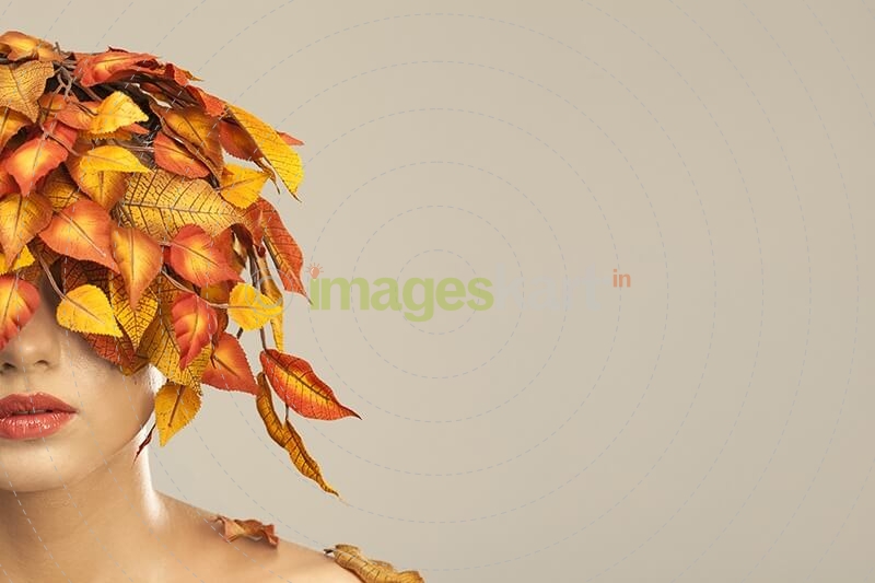 model covered with leaves portraying autumn