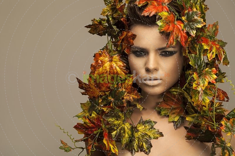 woman covered in leaves 