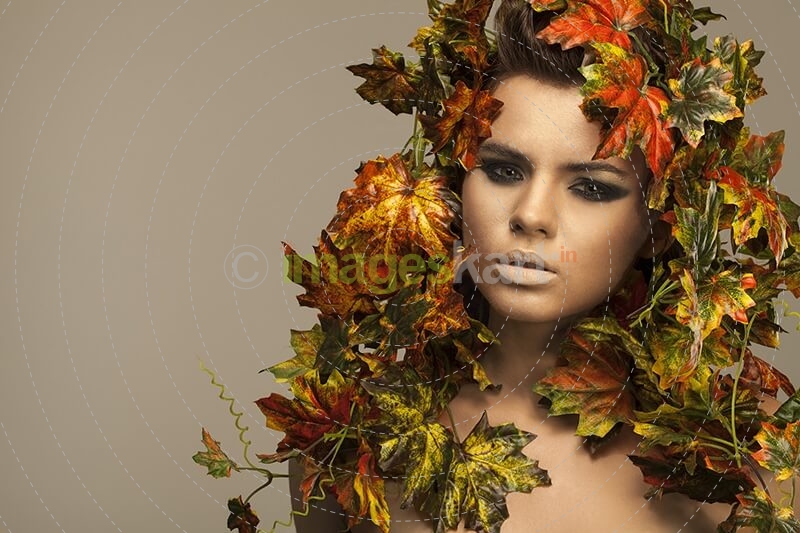 woman covered in leaves 