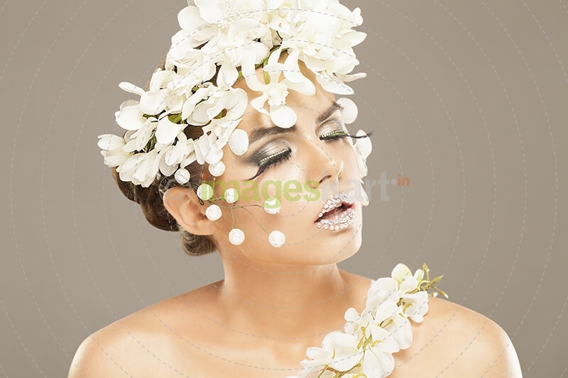 woman covered with white flowers