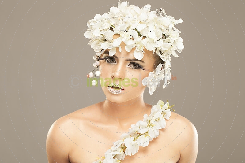 woman covered with white flowers
