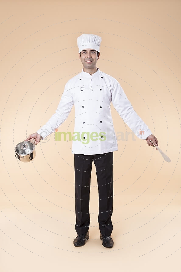chef posing with utensil 