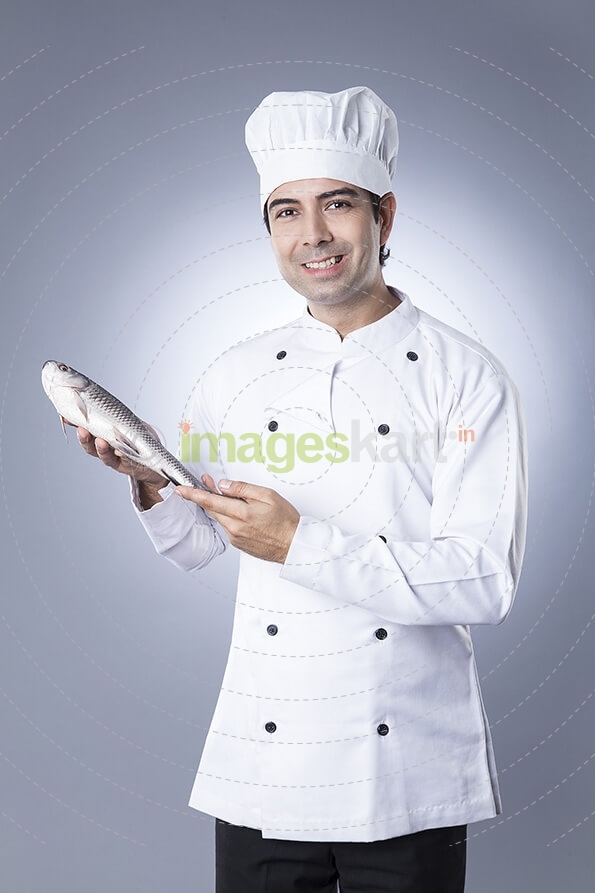 chef posing with fish 