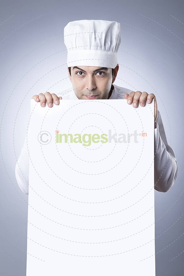 chef posing with placard