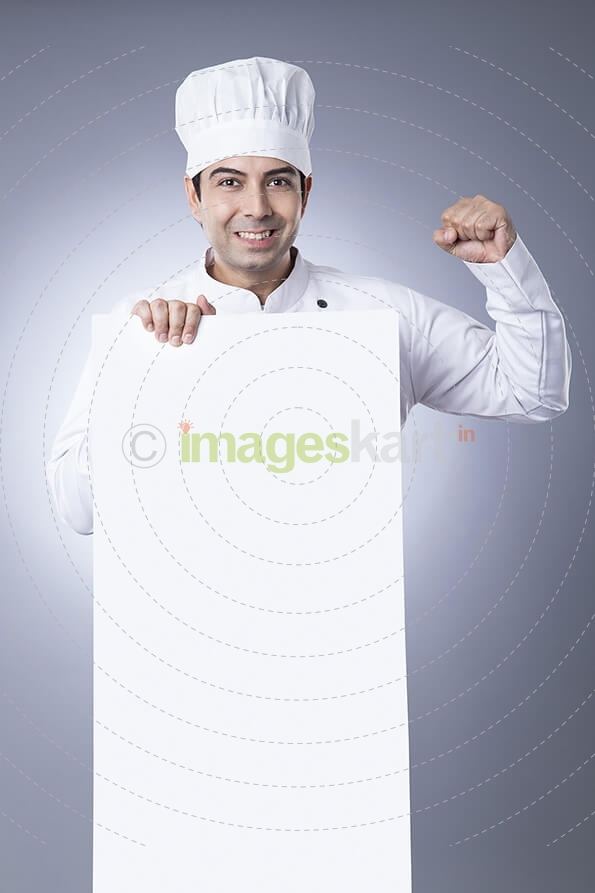chef posing with placard