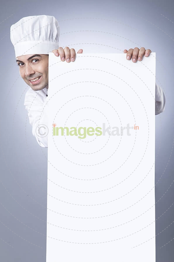 chef posing with placard