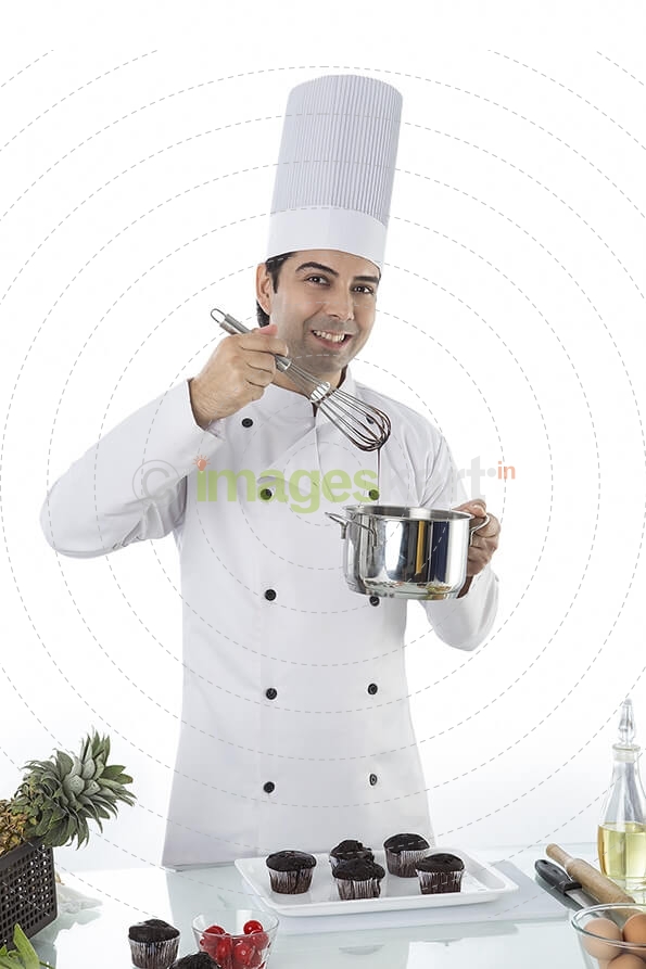 chef with cupcakes