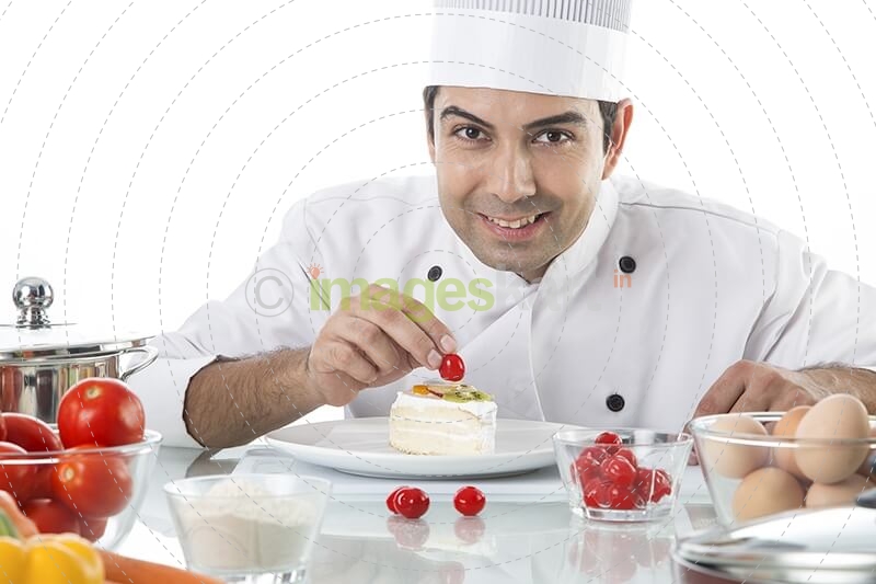 indian chef making dessert 