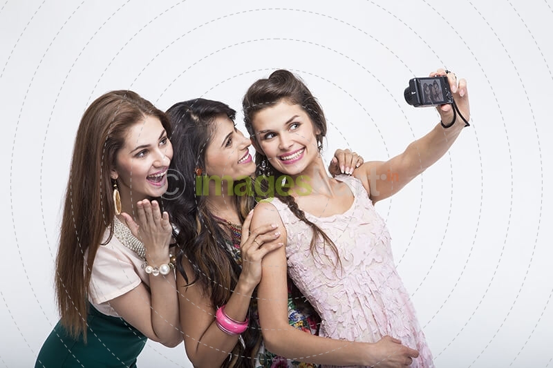 girls taking selfie