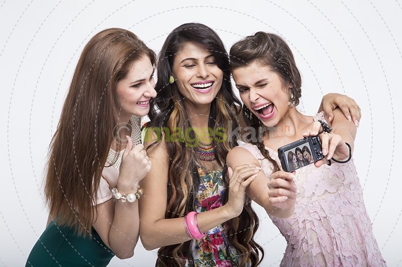 girls taking pictures