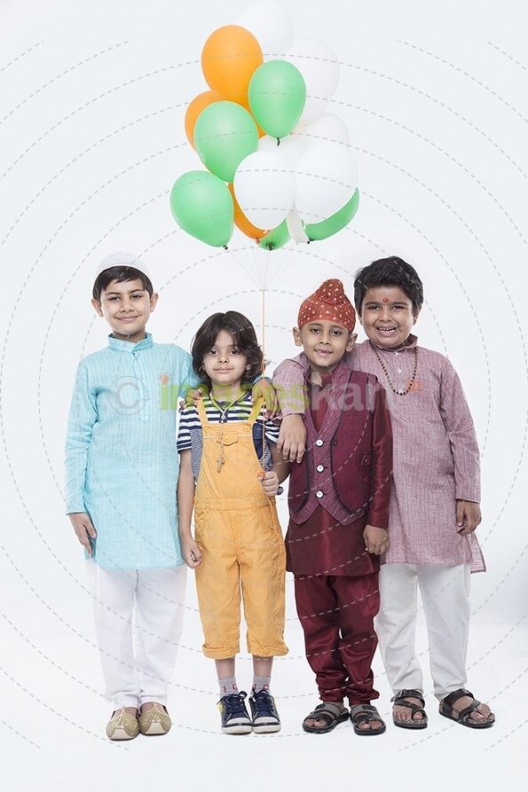 kids from different religions with balloons 