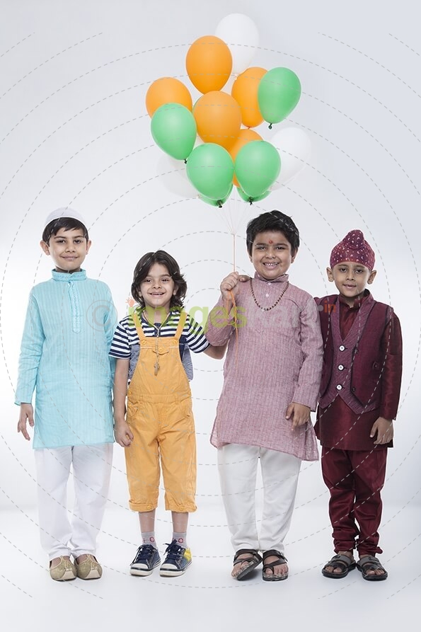 kids from different religions with balloons 