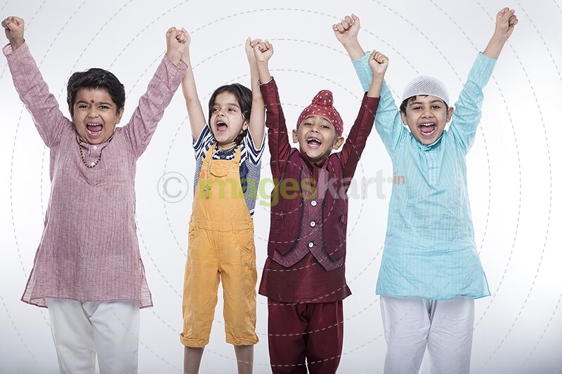 kids raising hands in excitement