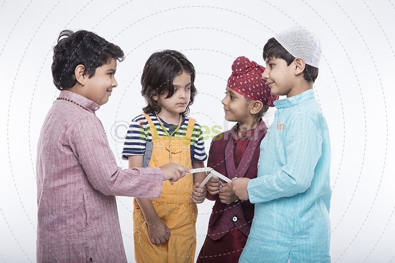 kids from different religion praying with candles