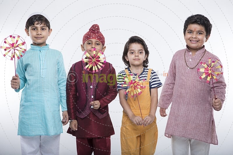 kids from different religions with windmill toy