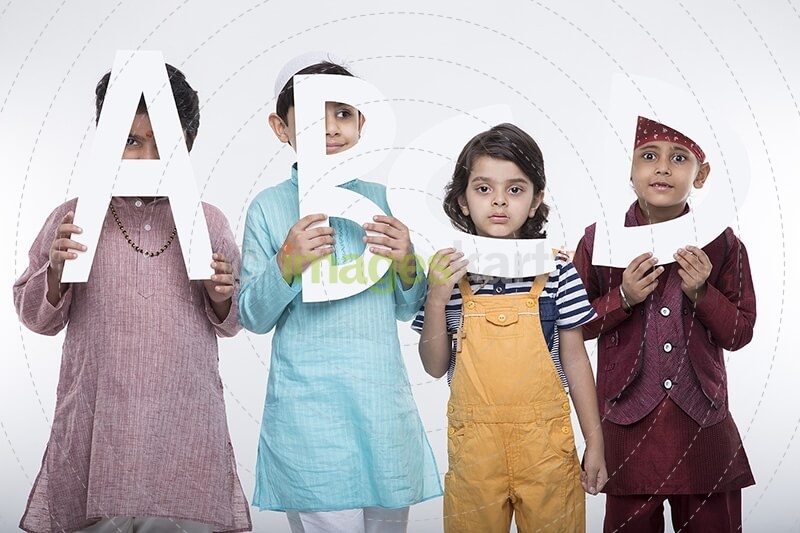 kids peeking through alphabets