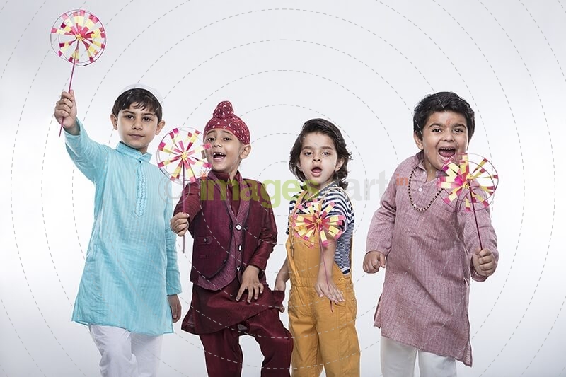 kids from different religions with windmill toy