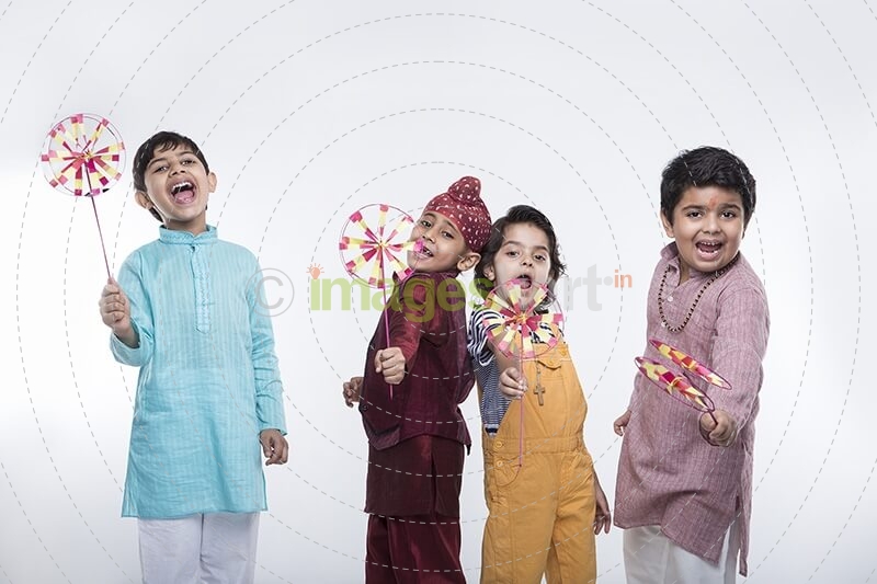 kids from different religions with windmill toy