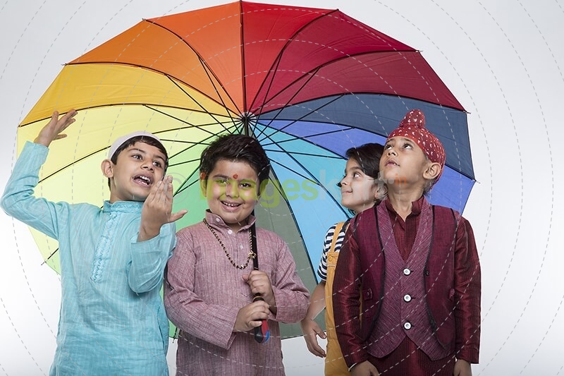 four kids from different religion under one umbrella