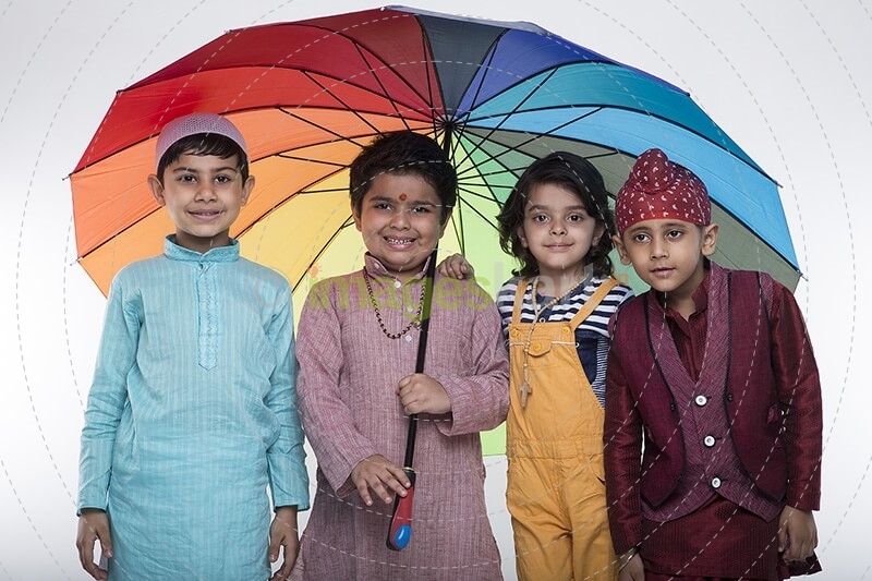 four kids from different religion under one umbrella