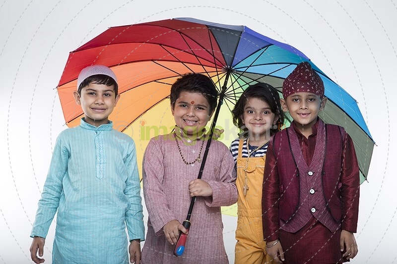 four kids from different religion under one umbrella