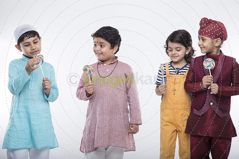 four kids posing with candy 
