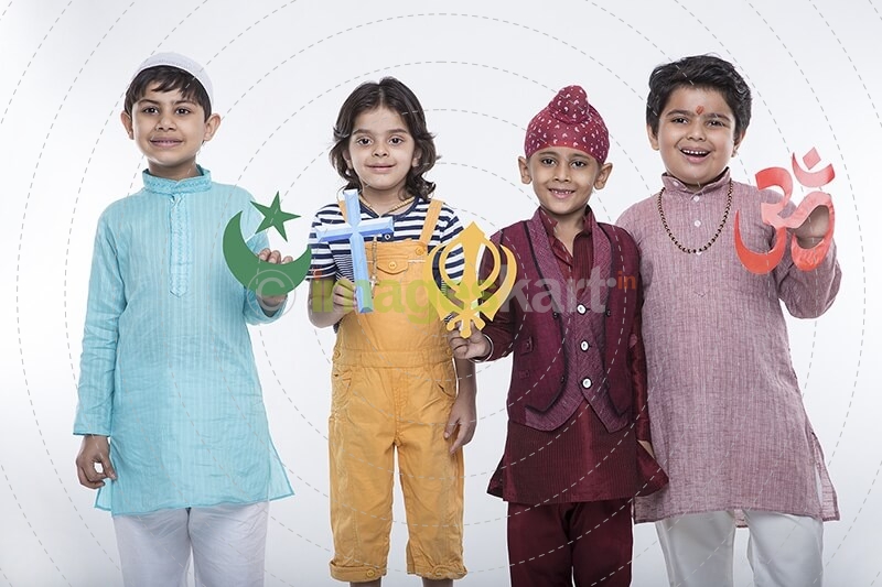 four kids posing with religious symbols