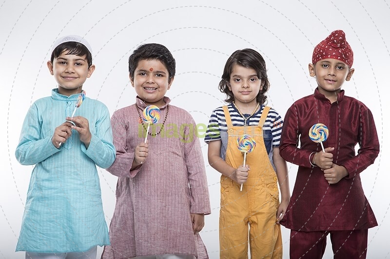 four kids posing with candy 