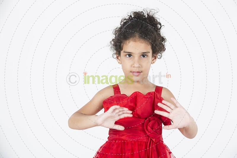 girl wearing red dress gesturing