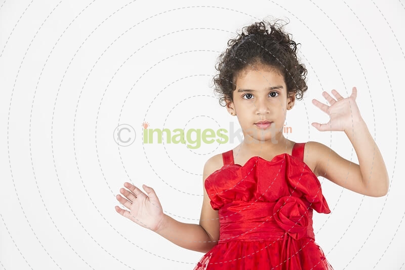 girl wearing red dress gesturing