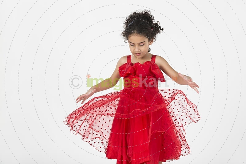 girl wearing red dress gesturing
