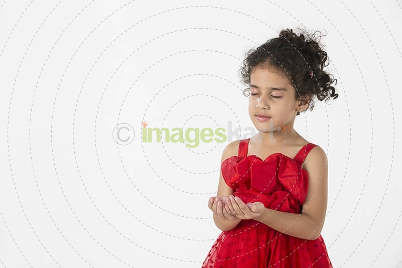 girl wearing red dress gesturing
