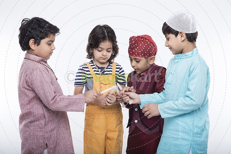 kids lighting candles