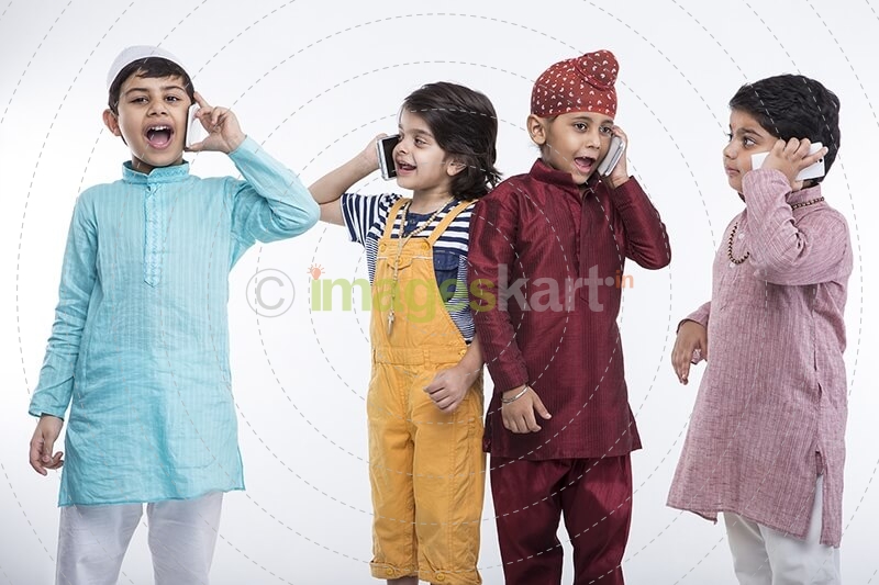 kids from different religions with mobile phones 