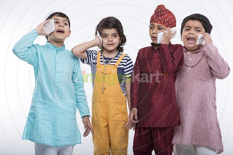 kids from different religions with mobile phones 