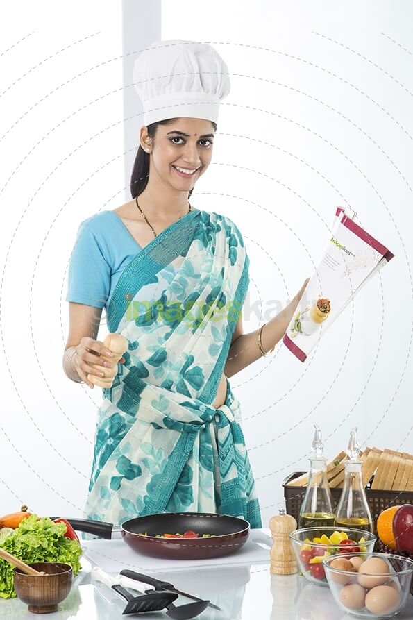 housewife cooking from recipe