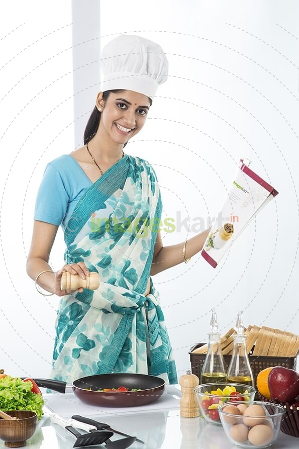 housewife cooking from recipe