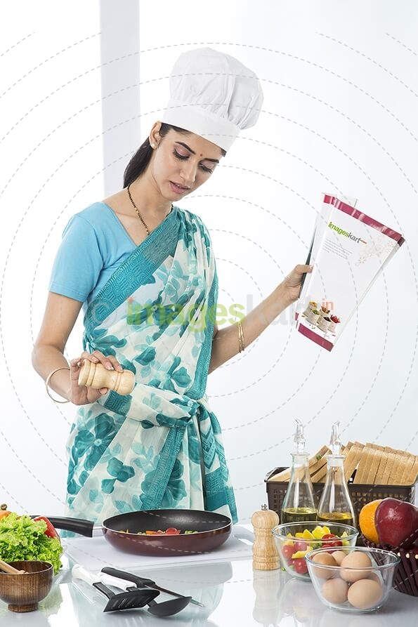 housewife cooking from recipe