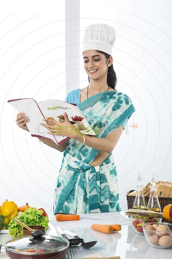 housewife cooking from recipe
