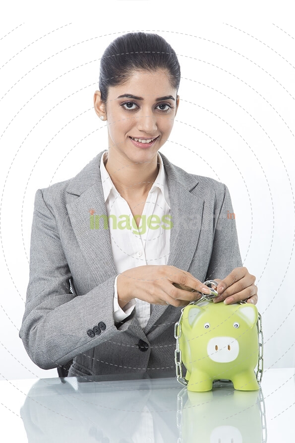 woman in formals with piggy bank 