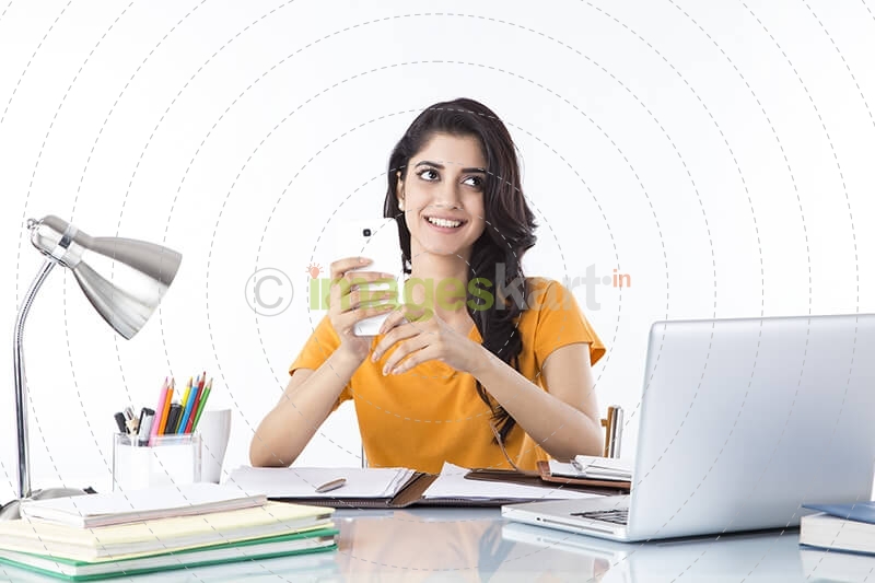 girl talking on phone while studying