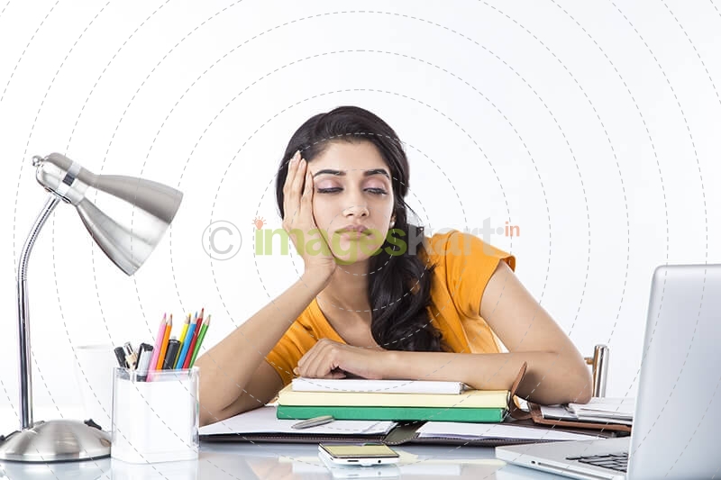 girl feeling sleepy after studying