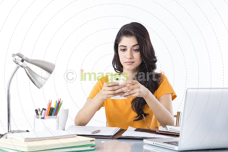 girl talking on phone while studying